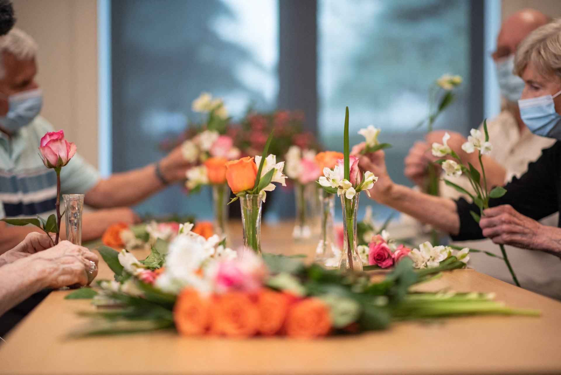 Residents learning flower arranging at the Growing Fields centre at Silvera's Westview community